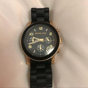 Black rubber coated gold-tone Michael Kors watch